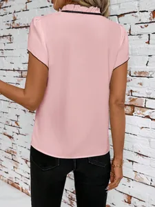 Detailed back view of elegant pink pleated short sleeve blouse with black ruffled collar.