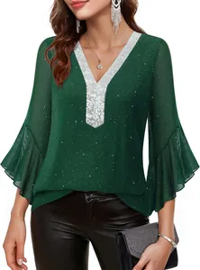 Detailed view of dark green blouse with silver sequins V-neck and bell sleeves texture