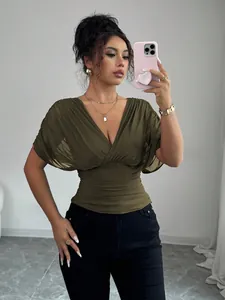 Fashionable olive green deep V-neck ruched waist top styled on model for chic look