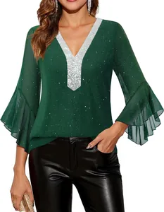 Detail view of shimmering green V-neck blouse with silver sequins and flared ruffled sleeves