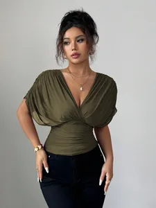 Detail view of olive green deep V-neck ruched waist top on model