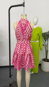 Detailed back view of a pink and white wave print halter neck sleeveless mini dress