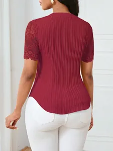 Back view of a burgundy ribbed short-sleeve top featuring elegant floral lace sleeves.