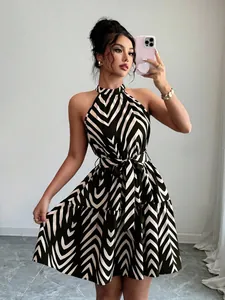 Close-up detail of the halter neck and wave stripe print on this stylish sleeveless dress