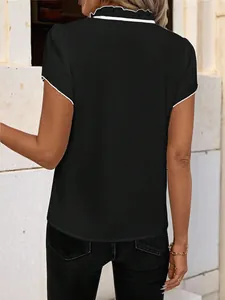 Back view of black women's blouse featuring white ruffle collar and piping details