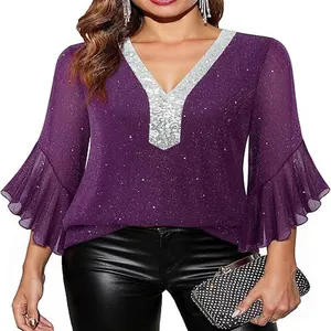Detailed view of deep V-neck purple blouse with silver sequins and ruffled bell sleeves.