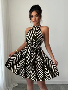 Elegant halter neck sleeveless mini dress featuring bold green and white wave stripe print