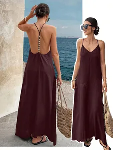 Detailed view of dark plum V-neck backless maxi dress with beaded strap detailing.