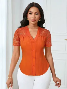 Detailed view of orange lace short sleeve top with single-breasted V-neck design