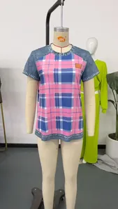 Casual women's short sleeve round neck t-shirt featuring pink plaid print and denim sleeves.