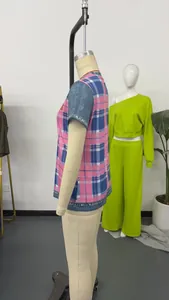 Side view detail of a pink and blue plaid short-sleeved loose top for women.