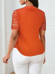 Back view of orange slim fit top featuring elegant lace sleeves and ribbed texture