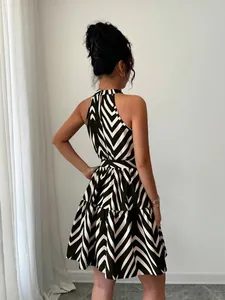 Rear detail view of the black and white chevron patterned halter neck sleeveless mini dress