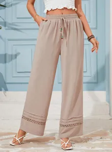 Elegant high-waisted wide-leg trousers in taupe with delicate lace hem and drawstring