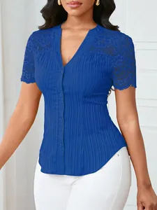 Close-up detail of royal blue slim fit blouse with elegant lace embroidered sleeves
