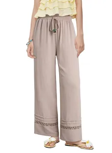 Elegant high-waisted wide-leg trousers in beige with delicate hollow-out hem detail