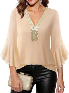 Detail showing deep V-neck with gold sequins and ruffled bell sleeves on top