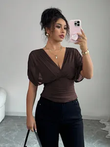 Elegant brown deep V-neck top featuring puff sleeves and a ruched waist design.