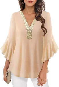Detail of elegant beige V-neck blouse with gold sequins and flared sleeves