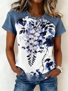 Detailed view of women's floral print top with denim-style sleeves and crew neck