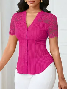 Detail of magenta slim fit top with delicate lace sleeves and button-down front.
