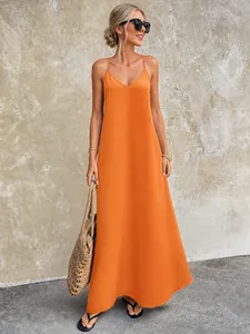 Detailed view of the textured orange V-neck backless camisole maxi dress