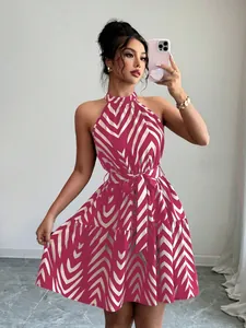 Close-up of a halter sleeveless dress featuring a red and white wavy stripe print.