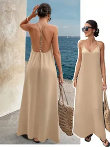 Beige V-neck backless maxi dress with beaded strap detail shown on model