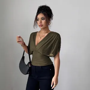 Chic olive green deep V-neck ruched top with flutter sleeves and waist-defining fit