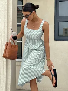 Close-up detail of a French style green and white striped sleeveless square neck midi dress
