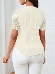 Back view of a slim cream ribbed knit top featuring elegant lace hollow short sleeves.