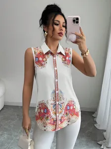 Detail view of a white sleeveless lapel blouse with vintage paisley print and buttons.