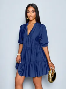 Detail view of stylish deep V-neck tiered ruffle mini dress with bubble sleeves in blue