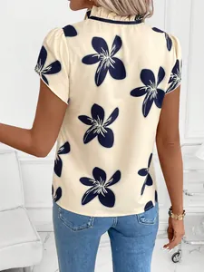 Back view of a chic floral print short sleeve blouse with ruffled collar detail