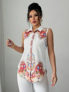 Close-up detail of a white sleeveless button-up shirt featuring vibrant ethnic paisley prints