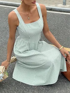 Detail of French style sleeveless square neck maxi dress with green and white stripes