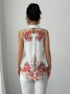 Back view of a white sleeveless collared blouse featuring a vibrant paisley print detail.