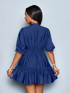 Rear view of elegant dark blue pleated short dress with puff sleeves and ruffled hem