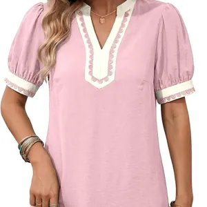 Elegant pink resort dress with white V-neck trim, scallop embroidery and short puff sleeves