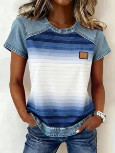 Detail view of women's short sleeve top with blue gradient stripes and denim texture