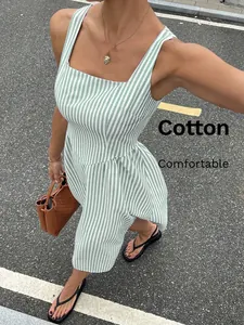 Detailed view of a green and white striped sleeveless midi dress with a square neck.