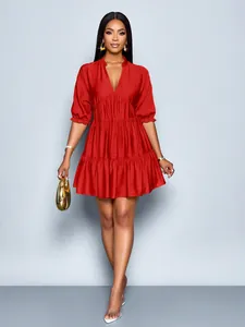 Full body view of a vibrant red V-neck mini dress featuring stylish puff sleeves