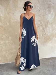 Detail of navy blue V-neck sleeveless maxi dress with white tie-dye floral patterns