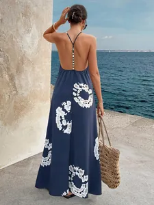 Detail of backless navy maxi dress with white tie-dye print and beaded back detail