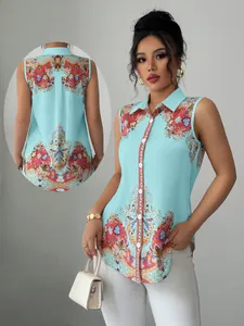 Detail view of light blue sleeveless shirt with colorful paisley print