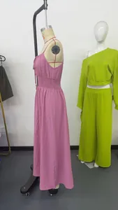 Side view of a pink sleeveless maxi dress with a shirred waist on a mannequin