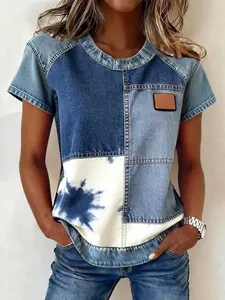 Detail showing a casual patchwork denim t-shirt with tie-dye print and small chest patch