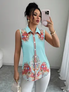 Detail of an elegant light blue sleeveless blouse with chic paisley pattern