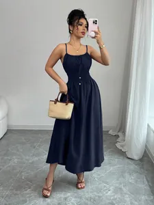 Elegant navy blue smocked waist cami midi dress with pleated details and gold buttons.