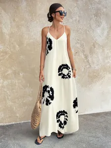 Stylish white V-neck sleeveless maxi dress with bold black tie-dye circular print detail